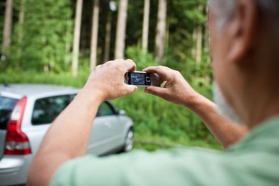 Seller photographing his vehicle